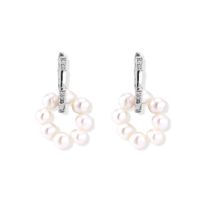 Rhodium-plated silver hoop earrings with freshwater pearls arranged in crescent formation and diamond accents