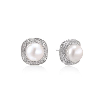Rhodium-plated sterling silver stud earrings with round freshwater pearls surrounded by geometric crystal halos on cream background.