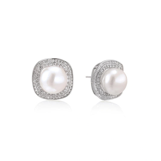 Rhodium-plated sterling silver stud earrings with round freshwater pearls surrounded by geometric crystal halos on cream background.