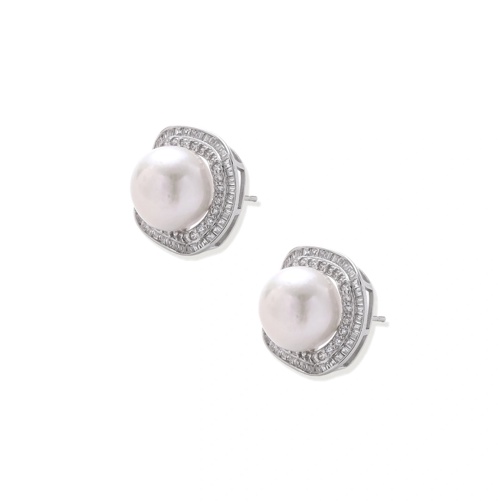 Rhodium-plated sterling silver stud earrings with round freshwater pearls surrounded by geometric crystal halos on cream background.