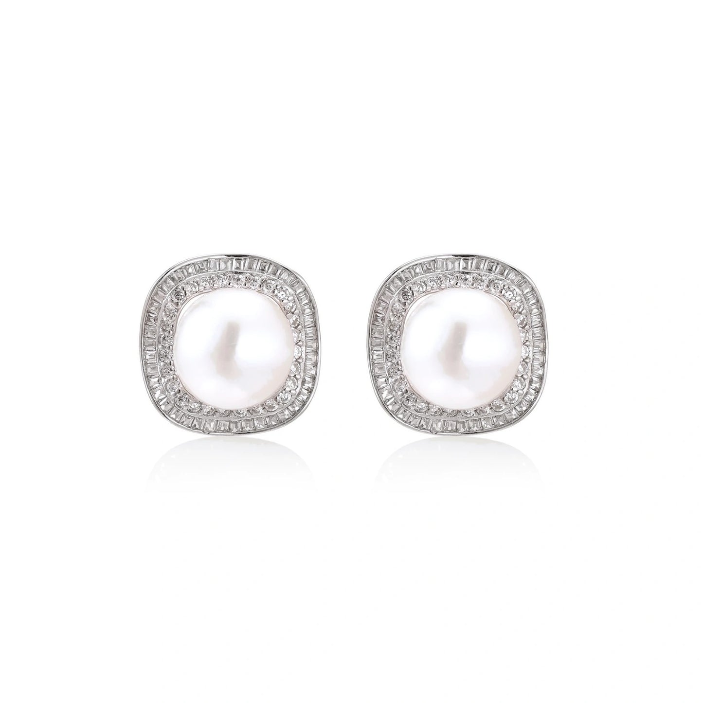 Rhodium-plated sterling silver stud earrings with round freshwater pearls surrounded by geometric crystal halos on cream background.