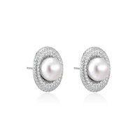 Elegant stud earrings with cream freshwater pearls surrounded by sparkly pavé crystals on rhodium-plated silver setting