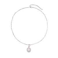 Oval sterling silver pendant with crystal halo surrounding a white freshwater pearl on delicate chain