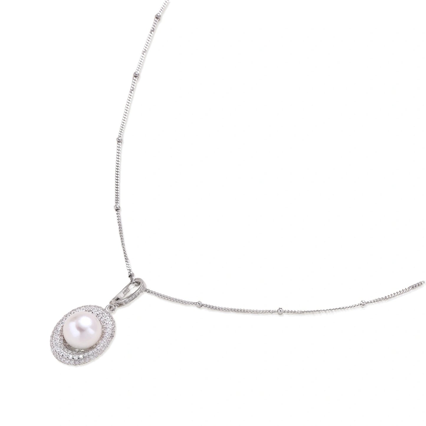 Oval sterling silver pendant with crystal halo surrounding a white freshwater pearl on delicate chain