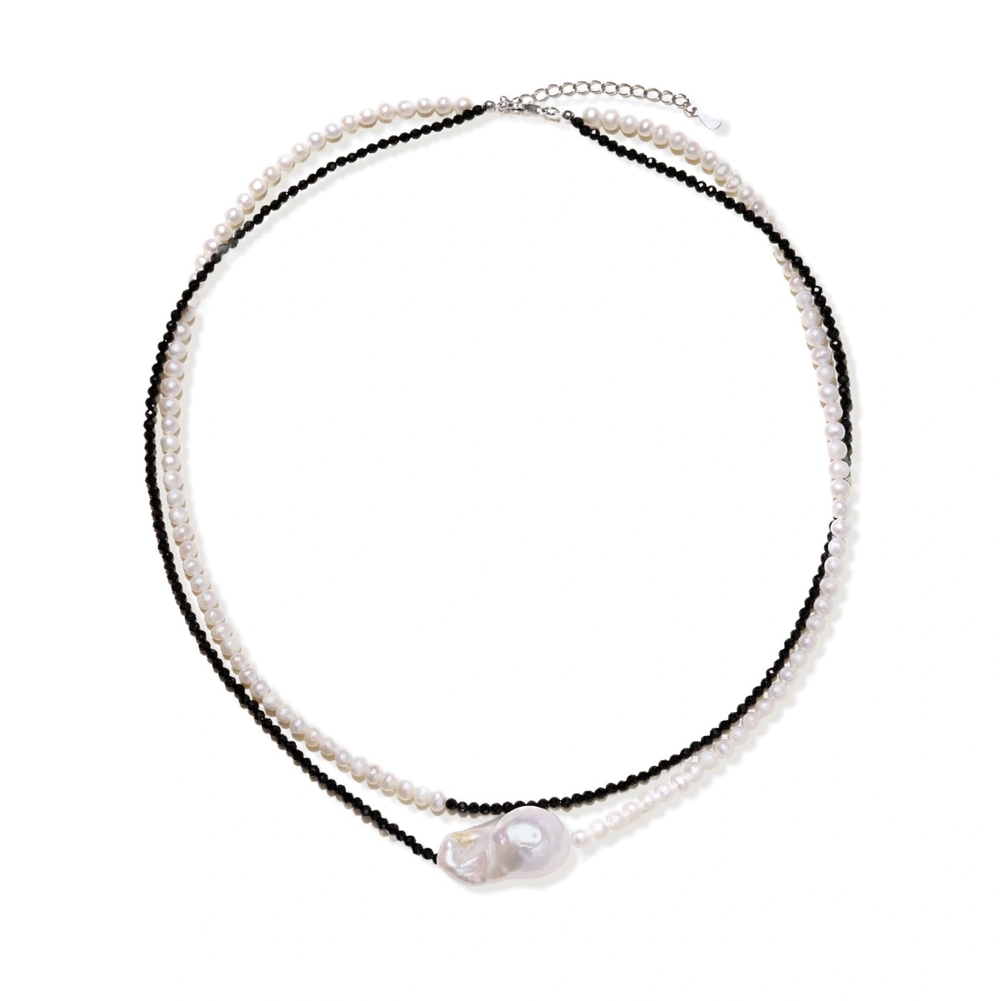 Double-strand necklace with black faceted quartz and white pearls featuring an oversized baroque pearl centerpiece