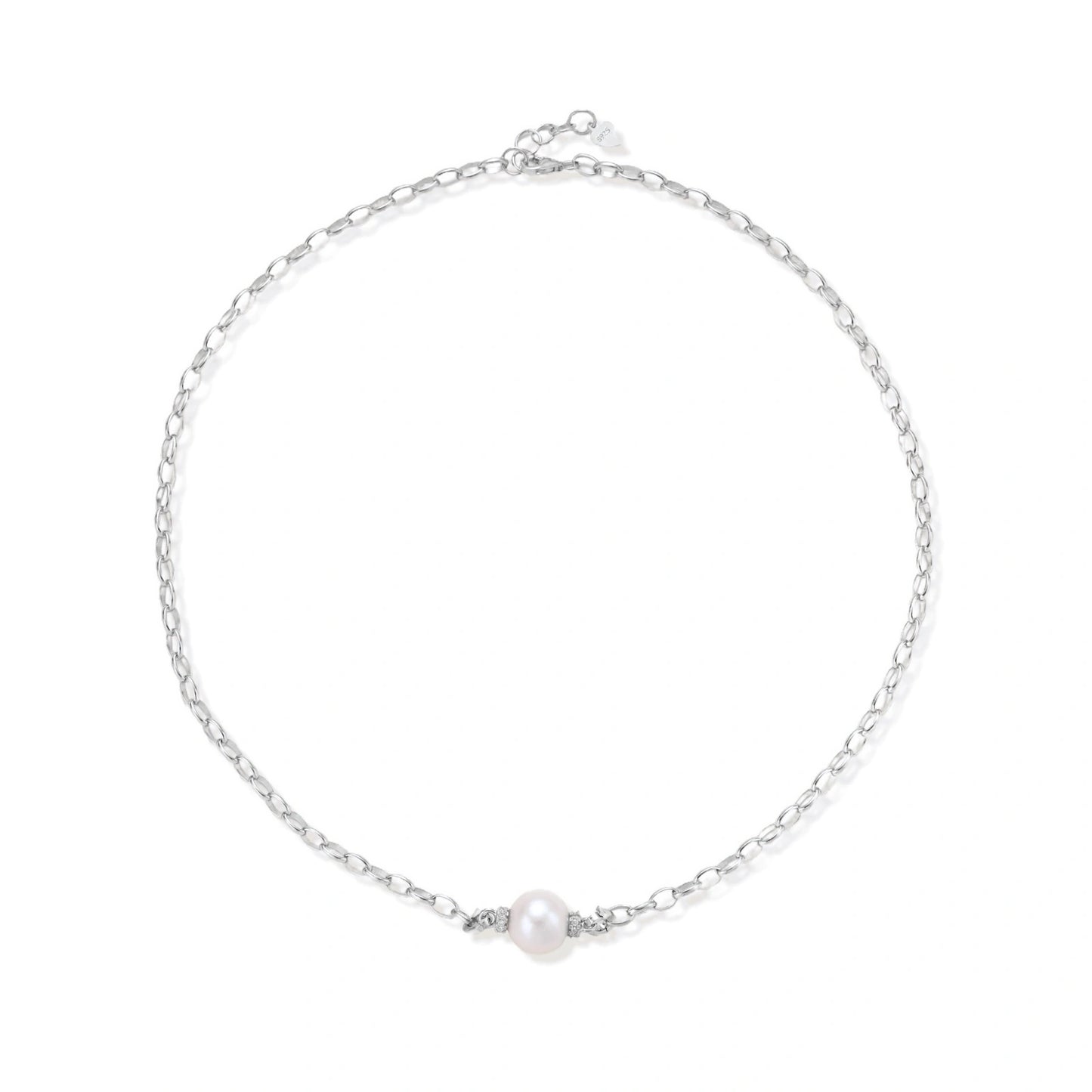 Dainty rhodium-plated silver chain necklace with centered 10mm freshwater pearl and crystal accents on cream background