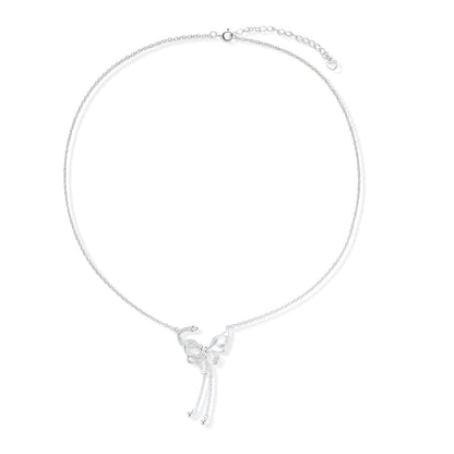 Sterling silver butterfly pendant with textured wing detail on adjustable Y-chain with ball drop ends