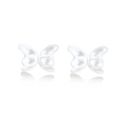 Pair of translucent butterfly-shaped stud earrings with frosted finish and dimensional wing details on white background