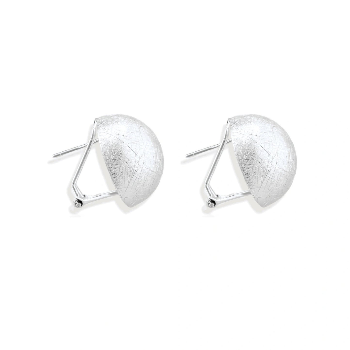 Brushed sterling silver half-dome clip-on earrings with textured surface against cream background