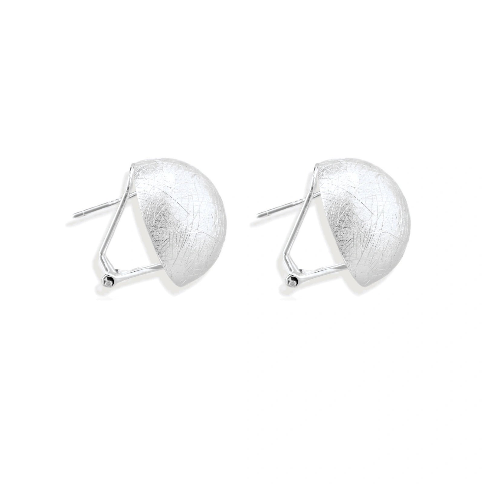 Brushed sterling silver half-dome clip-on earrings with textured surface against cream background