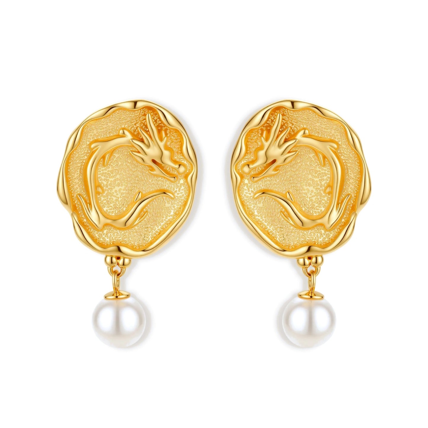 Ornate gold-plated dragon medallion earrings with white shell pearl drops on beige background, featuring detailed Chinese motifs.