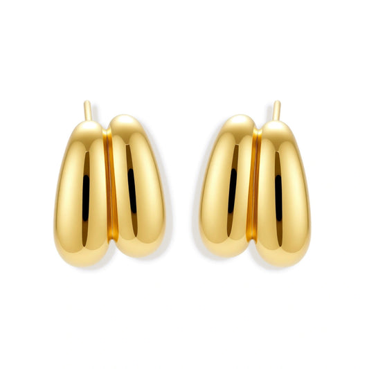 Chunky 18K gold-plated sterling silver hoop earrings with flowing sculptural curves on white background.