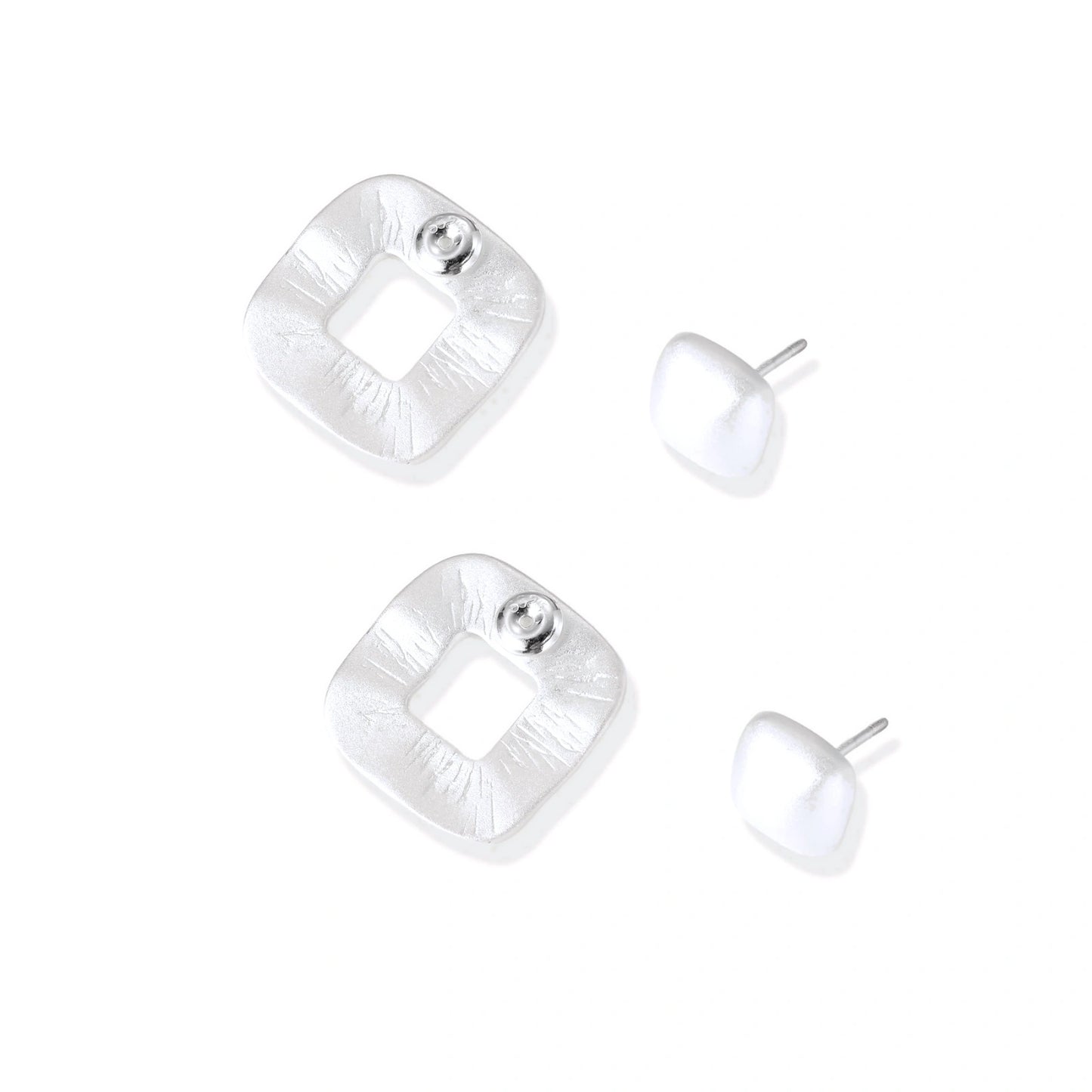 Pair of geometric sterling silver earrings with frosted square frames and glossy rounded studs on white background