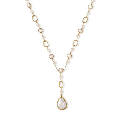 Long gold-plated necklace with alternating freshwater pearls and crystal bezels, featuring a large baroque pearl pendant