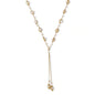 Adjustable gold lariat necklace with freshwater pearls nested in delicate cage settings and Y-shaped tassel drop